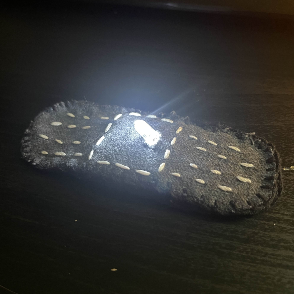 The band-aid when fully lit. The bare bones of the circuit are hidden underneath to give the physical indication that this patch is a band-aid.